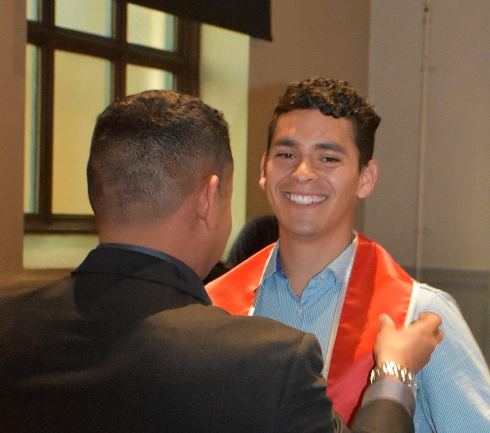 Photo of CAMP Scholar receiving their CAMP stole